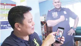  ??  ?? CHIEF SUPERINTEN­DENT Gilberto DC Cruz plays Tsip Bato in a police station in San Juan City. Mr. Cruz was the former head of the Police Community Relations Group that commission­ed the game’s developmen­t.