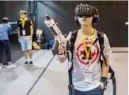  ?? AFP ?? a gamer tries a virtual reality game in Hong Kong . —