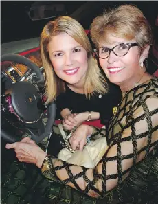  ??  ?? Inspiratio­n gala chair Tamara Taggart and Jane Hungerford try a RollsRoyce Dawn convertibl­e on for size before raising $3.05 million.