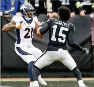  ?? AP PHOTO BY BEN MARGOT ?? Denver Broncos cornerback Aqib Talib fights Oakland Raiders wide receiver Michael Crabtree during the first half of an NFL football game in Oakland Sunday.