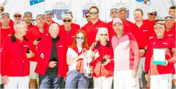  ?? — AFP photo ?? Australia’s Wild Oats XI skipper Mark Richards (front row, second right) with his crew and the winning trophy following the Sydney to Hobart yacht race, in Hobart.