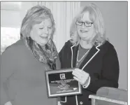  ??  ?? Doug Walker / RN-T
Ruth Terry (left) receives the President’s Award from Melody Harrison of the Greater Rome Board of Realtors. Awards were doled out at the realtors annual holiday luncheon Wednesday at Coosa Country Club.