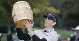  ?? — AP ?? NAPA: Brendan Steele lifts up his trophy on the 18th green of the Silverado Resort North Course after winning the Safeway Open PGA golf tournament, Sunday, in Napa, Calif.