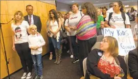  ?? Melody Gutierrez Los Angeles Times ?? ADRIANE HOEFT of Roseville, left, was among those who spoke against the vaccinatio­n bill, saying its passage would force her to home- school her children.