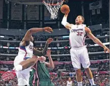  ?? Robert Gauthier Los Angeles Times ?? BLAKE GRIFFIN DOES what Blake Griffin does best, slamming home a dunk against the Bucks during the first half.