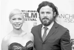  ??  ?? Actors Michelle Williams (left) and Casey Affleck pose for photograph­ers at a Gala screening of their film ‘Manchester by the Sea’ at the 60th BFI London Film Festival in London, Britain Oct 8, 2016. — Reuters photo