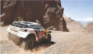  ??  ?? PEUGEOT’S FRENCH DRIVER Sebastien Loeb and co-driver Daniel Elena compete during Stage 3 of the 2017 Dakar Rally between San Miguel de Tucuman and San Salvador de Jujuy, Argentina on Jan. 4.