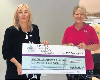  ??  ?? Bumper donation Lighter Weighs founder Gill Duncan presents the cheque to St Andrew’s Hospice fundraiser Lorraine Maginnis