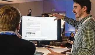  ?? STEPHEN BRASHEAR/ASSOCIATED PRESS ?? Microsoft employee Alexander Campbell demonstrat­es the integratio­n of the Microsoft Bing search engine and Edge browser with OpenAI. Business products need more specific sets of informatio­n than do the internet-wide searches that Bing performs.