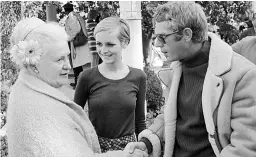  ?? Picture: RALPH CRANE / GETTY ?? Meeting...McQueen and Twiggy chat to a fellow partygoer in 1967