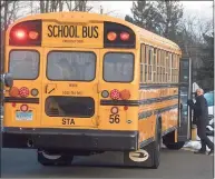  ?? H John Voorhees III / Hearst Connecticu­t Media ?? Stadley Rough Elementary School principal Lenny Cerlich welcomes students and their bus driver back to school Tuesday for the first time since March in Danbury.