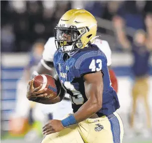  ?? PAULW. GILLESPIE/CAPITAL GAZETTE ?? Navy fullback Nelson Smith rushed for 120 yards and two touchdowns Saturday against Temple.