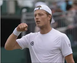  ?? ALASTAIR GRANT — THE ASSOCIATED PRESS ?? Tim van Rijthoven celebrates winning the first set against Nikoloz Basilashvi­li in Friday’s third-round match at Wimbledon. Van Rijthoven plays Novak Djokovic next.