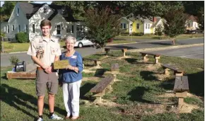  ?? Jeremy Stewart / Rome News-Tribune ?? William Davis (left) and Elm Street Principal JoAnn Moss pose in Davis’ Eagle Scout project, which includes benches, landscapin­g and a small demonstrat­ion platform.