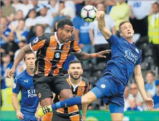  ?? Picture: AFP ?? HEAD TO HEAD: Hull City’s English midfielder Tom Huddleston­e, left, and Leicester City's Welsh midfielder Andy King compete for a header during their English Premier League match at the KCOM Stadium at the weekend