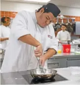  ?? ?? Washburne Culinary and Hospitalit­y Institute student Preston Cisneros prepares a cream for mini buttermilk biscuits at Kennedy-King College in Englewood on Wednesday.