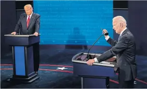  ?? MORRY GASH POOL/AFP VIA GETTY IMAGES ?? U.S. President Donald Trump debates former vice-president Joe Biden in the final presidenti­al debate at Belmont University in Nashville, Tenn., on Thursday. Trump did seem to have taken the advice to avoid interrupti­ons this time, Edward Keenan writes.