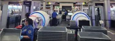  ?? PHOTO PROVIDED ?? New CT scanners at a TSA security checkpoint at Albany Internatio­nal Airport provides state-of-the-art technology that has enhanced security screening capabiliti­es.