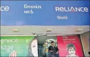  ?? REUTERS ?? RCom store in Ahmedabad. Under the company’s new debt repayment plan, RCom envisages raising ₹27,000 crore through sales of assets including spectrum, real estate and towers