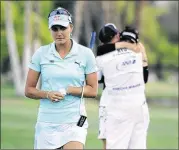  ?? JEFF GROSS/GETTY IMAGES ?? A two-stroke penalty received by Lexi Thompson (left) for an incorrect scorecard was added to two strokes she already lost, and she ended up losing the ANA Inspiratio­n event to So Yeon Ryu (right).