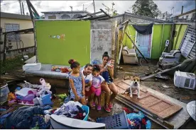  ?? RAMON ESPINOSA / ASSOCIATED PRESS ?? Arden Dragoni supported his family by working constructi­on, but his employers are currently out of business, leaving him and his family without a home or a source of income in Toa Baja, Puerto Rico.