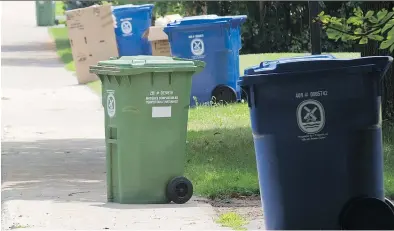  ?? PHIL CARPENTER/FILES ?? Only the city-authorized green organic waste bins can be emptied by city trucks.