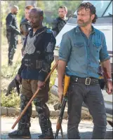  ??  ?? Lennie James portrays Morgan Jones, left, and Andrew Lincoln portrays Rick Grimes, in a scene from “The Walking Dead.”