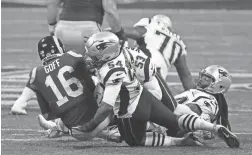  ??  ?? Rams quarterbac­k Jared Goff is sacked by Patriots outside linebacker Dont’a Hightower during Super Bowl LIII on Sunday.