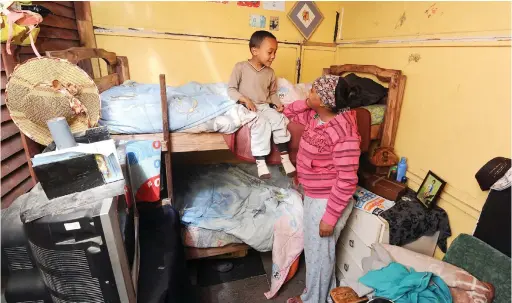  ?? PICTURE HENK KRUGER/ANA ?? POOR LIVING CONDITIONS: Bronwyn Smith and her son, Diego, 5, inside his room which he shares with his sister, Azalia Smith, 11. Smith and her children have been living in a wendy house in the backyard of a property in Tafelsig for the past three years.