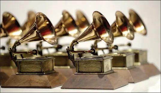  ?? JULIO CORTEZ / AP FILE (2017) ?? Grammy Awards are displayed in 2017 at the Grammy Museum Experience at Prudential Center in Newark, N.J. The 2023 Grammy Awards will air live Sunday.