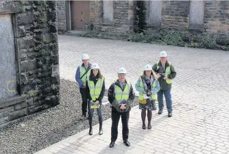  ??  ?? New course HES postgradua­te course manager Gordon Urquhart with students on a site visit to the former Ministry of Defence buildings in Forthside