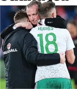  ?? GETTY IMAGES ?? End of the road: Northern Ireland manager Michael O’Neill consoles Oliver Norwood and Aaron Hughes in Basel