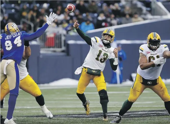  ?? THE CANADIAN PRESS ?? Edmonton quarterbac­k Mike Reilly threw for 334 yards and three touchdowns as the Eskimos beat Winnipeg 39-32 on Sunday.