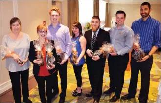  ?? STEVE MacNAULL/The Okanagan Weekend ?? Patrick Moros from the Best Western Kelowna, third from right, was chosen as the winner from a field of eight finalists for the inaugural Heart of Hospitalit­y Award. In the group are, from left, Cathy Luknowsky from the Best Western Wine Country in...