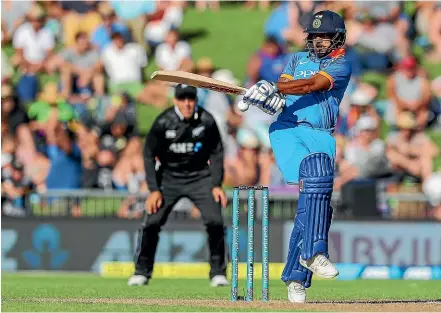  ?? PHOTOSPORT ?? India opener Shikhar Dhawan plays a shot to the boundary on his way to an unbeaten 75 runs during yesterday’s first one-dayer against the Black Caps in Napier.