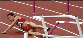  ??  ?? Downfall: Bulgaria’s Vania Stambolova falls during the 400m hurdles in the 2012 Olympics