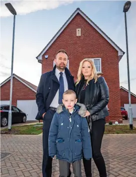  ??  ?? Fury: The Price family with new lamppost (left) and the original