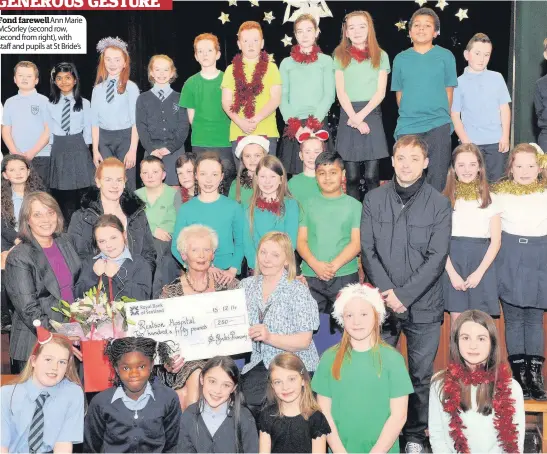  ??  ?? Fond farewellAn­n Marie McSorley (second row, second from right), with staff and pupils at St Bride’s