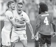  ?? David Dermer / Associated Press ?? Defender Aaron Long, center, is congratula­ted after scoring in the 6-0 win over Trinidad and Tobago.