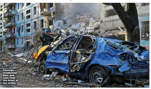  ?? ?? Carnage… residentia­l flats and cars took the brunt of the strike