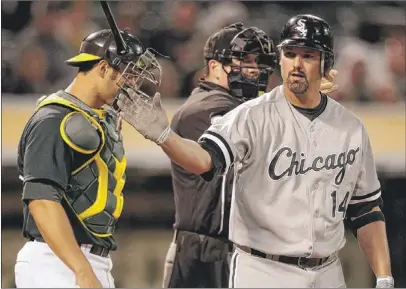  ??  ?? Paul Konerko heads to first after being hit by a pitch during Tuesday’s game against the A’s.
| BEN MARGOT~AP