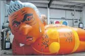  ?? AP ?? A blimp of London Mayor Sadiq Khan “rests” at a workshop in Oxfordshir­e.