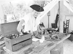  ??  ?? A Continenta­l Army surgeon in the surgeon’s tent at the American Revolution Museum at Yorktown’s Continenta­l Army encampment in Yorktown, Virginia. — WP-Bloomberg photo