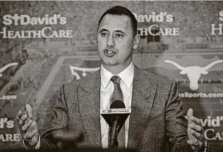  ?? Caten Hyde / Texas Athletics ?? UT’S Steve Sarkisian, speaking at his introducto­ry news conference Jan. 12, will earn $5.2 million in base salary in Year 1. That base will escalate by $200,000 per year, up to $6.2 million in Year 6.