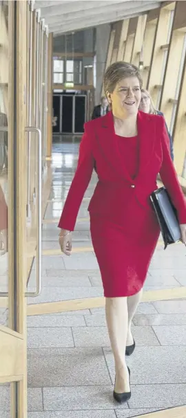  ?? ?? ↑ Nicola Sturgeon and her deputy John Swinney at the Scottish Parliament for First Minster’s Questions yesterday