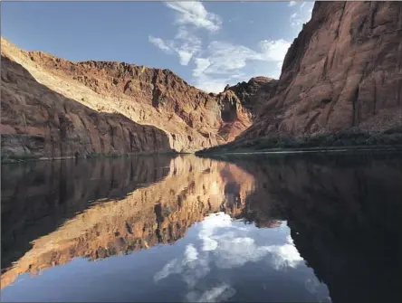  ?? Carolyn Cole Los Angeles Times ?? LAKE POWELL, shown in July, and Lake Mead, the country’s two largest reservoirs, are now about three-fourths empty. The seven states that depend on the Colorado River have failed to meet a Tuesday deadline for agreeing on a water-use reduction plan.