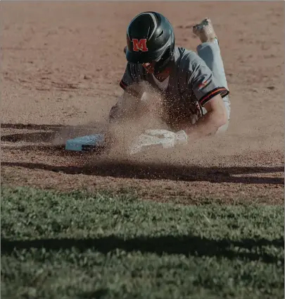  ?? Courtesy of Klaudia Rose ?? Marysville’s Wyatt Locco hits a triple and slides into third base Thursday at River Valley. RV won 15-2 to move to 3-2 heading into a home game today at 11 a.m. against Twelve Bridges.