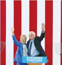  ?? (Reuters) ?? PRESUMPTIV­E DEMOCRATIC presidenti­al candidate Hillary Clinton poses with former rival Sen. Bernie Sanders, before he endorsed her candidacy at a campaign rally in Portsmouth, New Hampshire, on July 12.