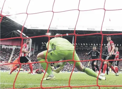  ?? Picture: Getty Images ?? OOPS. Sheffield United goalkeeper Dean Henderson lets the ball go through his legs during their 1-0 loss to Liverpool at Bramall Lane on Saturday.