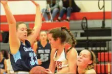  ??  ?? VVS senior Alexa Kiser (21) wrestles a rebound away from CVA junior Reilly Rich (11) during Section III Class B opening round action on Friday, Feb. 15.